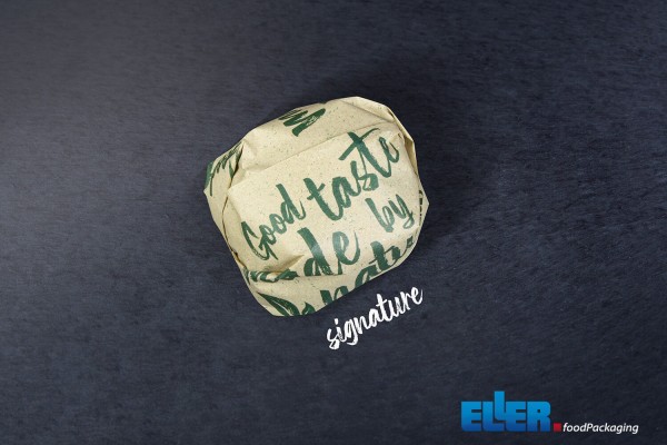WrappingPaper im signature Design verpackt einen Burger mit Sicht aus der Vogelperspektive.